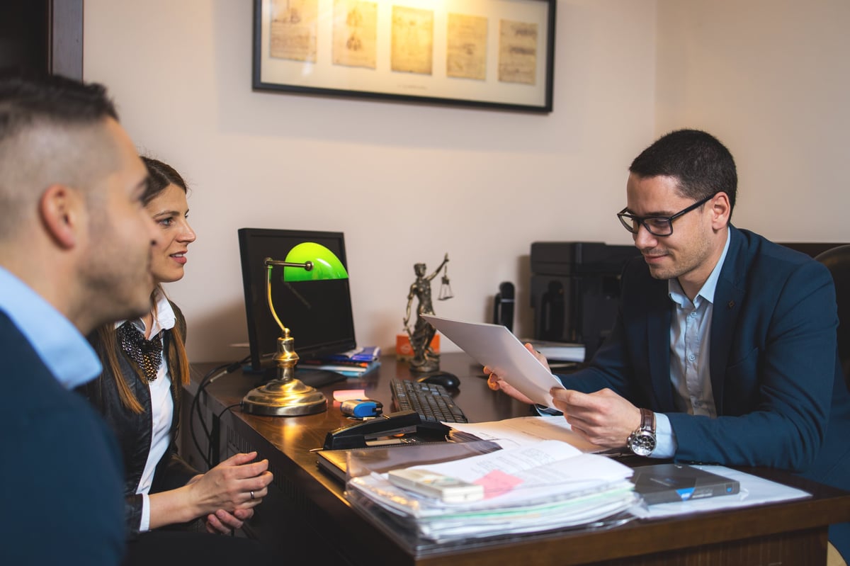Albanian speaking criminal defence solicitor explaining UK criminal charges to a client during a legal consultation