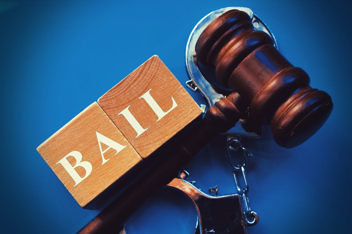 Free Legal Aid bail application solicitor presenting bail case with gavel representing release from custody in criminal proceedings