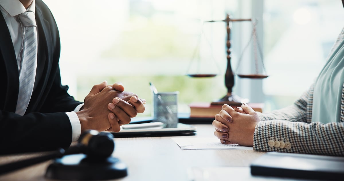Gavel, lawyers and hands of business people in meeting for legal consultation, contract and discussion. Corporate, professional and workers in office for legislation, agreement and deal at law firm