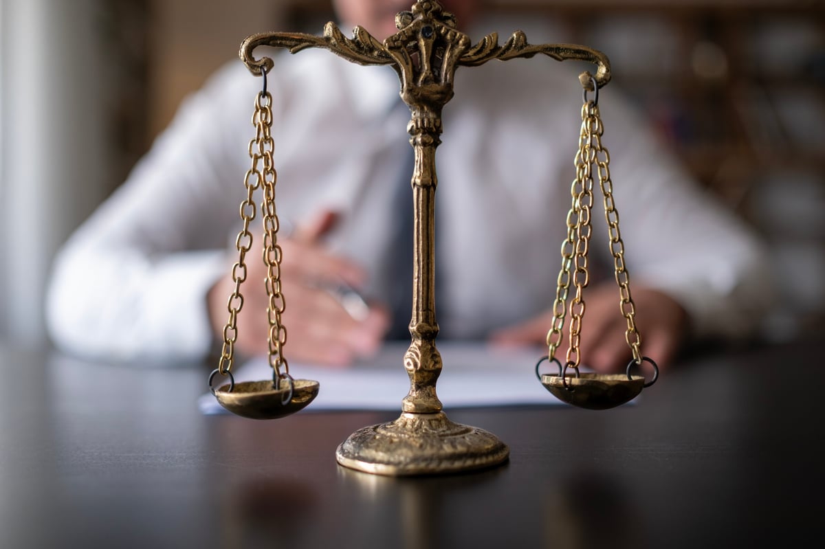 Free Legal Aid criminal defence services with golden scales of justice represented by a criminal lawyer specialising in Legal Aid criminal proceedings across England and Wales