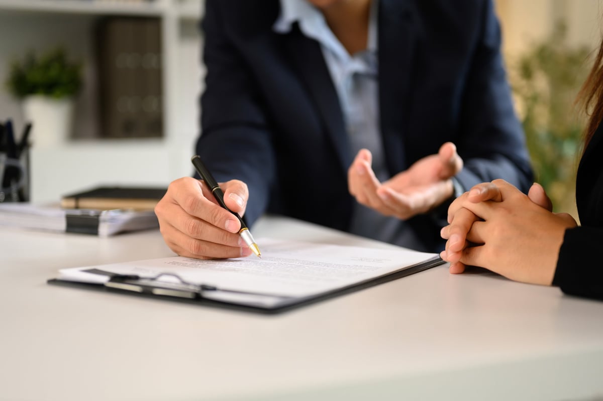 Fraud by abuse of position case solicitor at Woolfe and Co providing expert Section 4 Fraud Act 2006 defence advice during a professional consultation