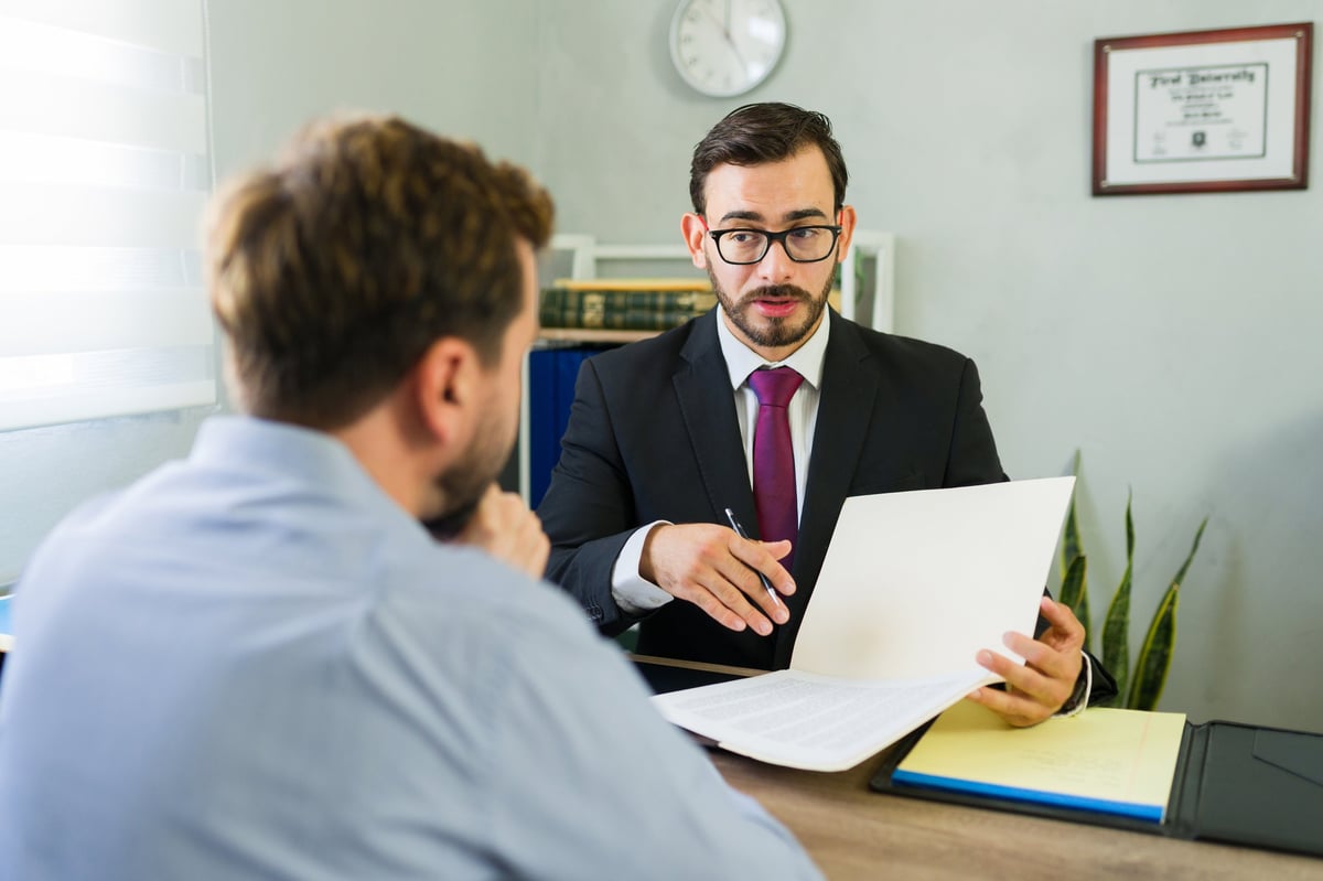 Free Legal Aid voluntary police interview solicitor providing confidential legal advice to a client before attending an interview under caution at a police station