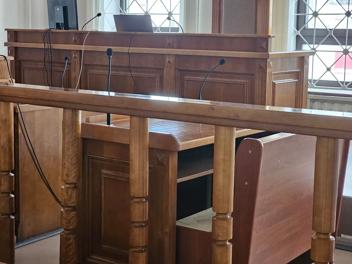 Free Legal Aid Crown Court solicitor courtroom with benches and legal seating representing criminal defence at Crown Court proceedings