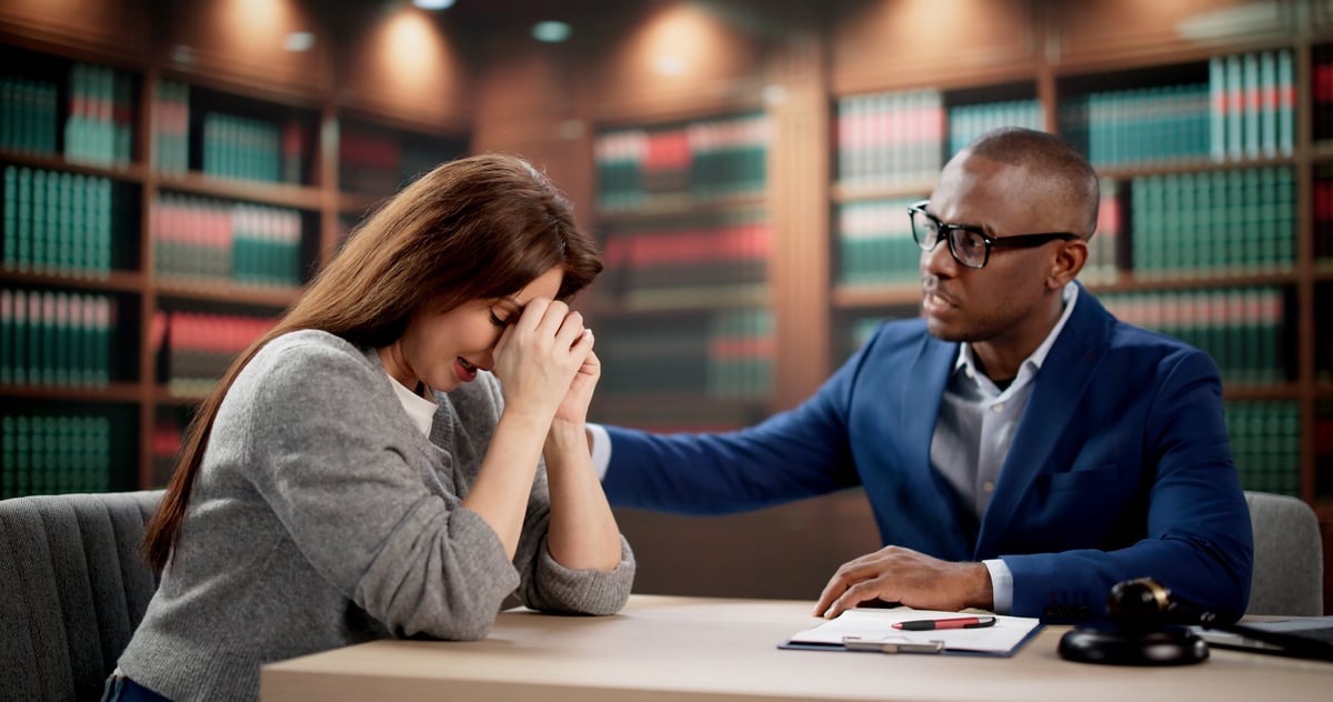 Solicitors representing a client facing attempted murder charges during a confidential consultation with a criminal defence lawyer