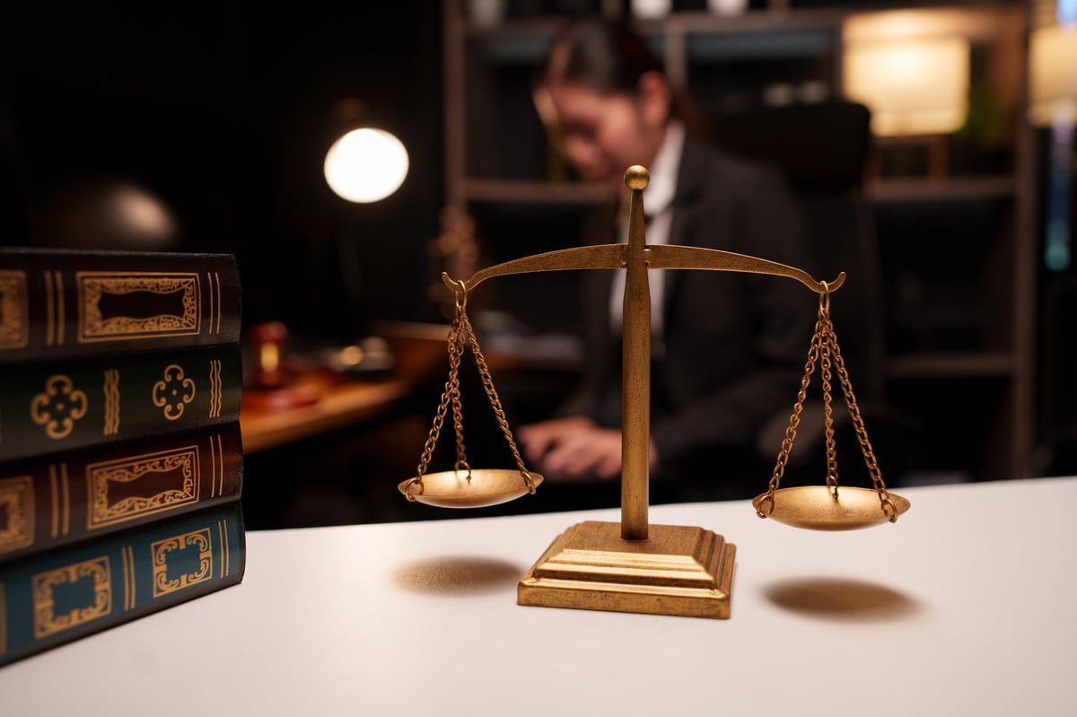 Fraud charges solicitor for bank employees reviewing case documents and preparing legal defence