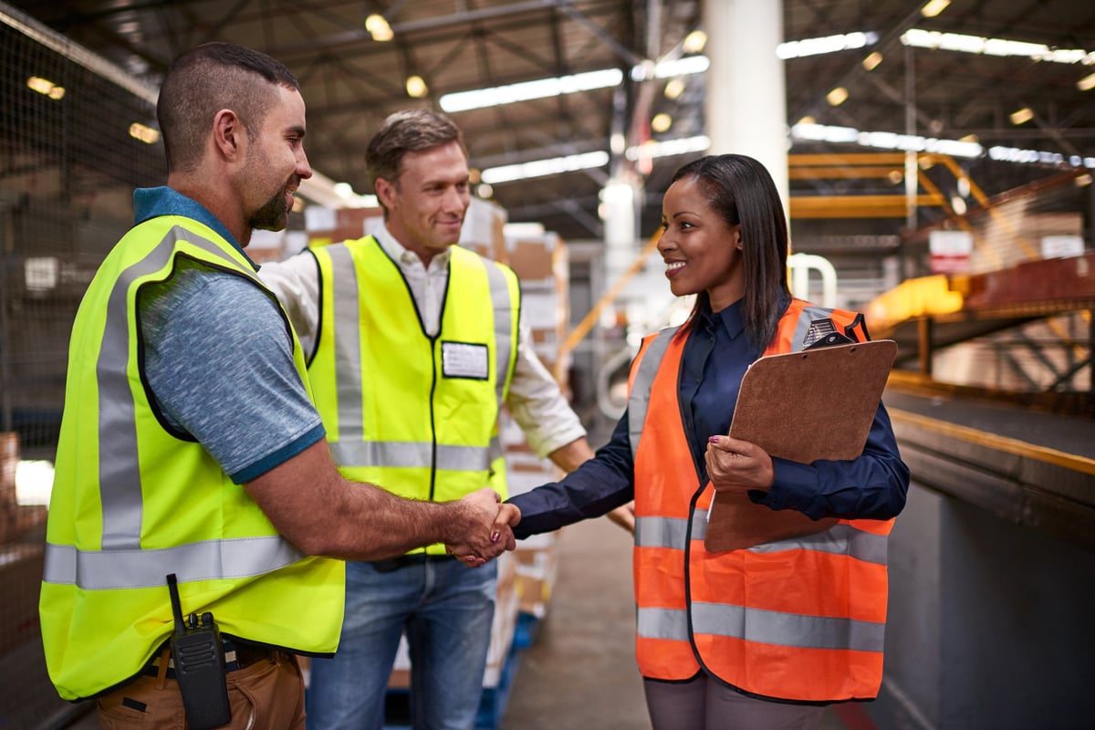 Corporate manslaughter solicitors meeting business leaders in a warehouse to discuss employer health and safety defence